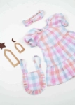 صورة فستان قرقيعان وردي فاتح مع حقيبة لحديثي الولادة 2023